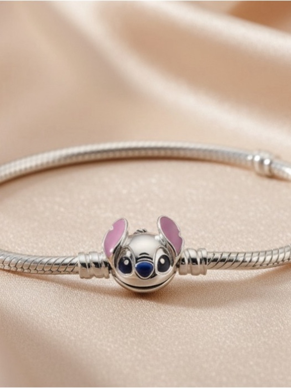 Silver Charm Bracelet with Pink-Eared Stitch Charm